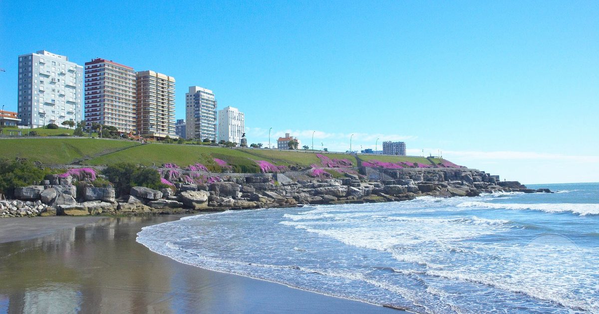 Waves on the beach with the Mar del Plata skyline behind, Argentina