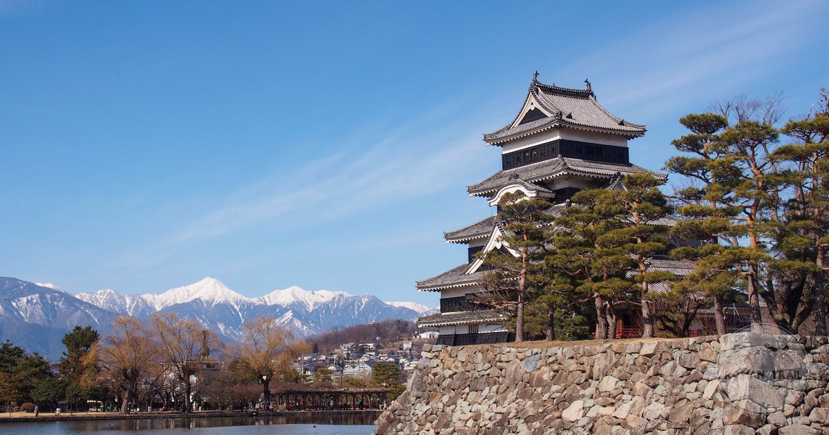 Matsumoto Castle with snow capped mountains behind, Nagano, Japan
