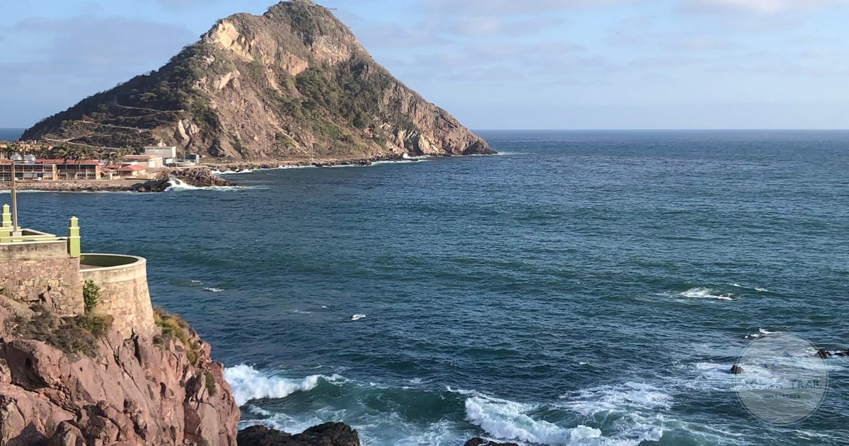 Rocky cliffs and a headland under a clear sky at Mazatlan, Mexico