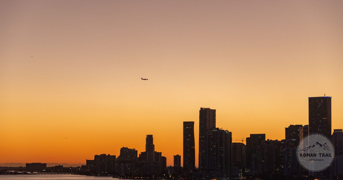 Golden sunset over the Miami skyline across Biscayne Bay, Miami travel guide for women by Roman Trail Outfitters