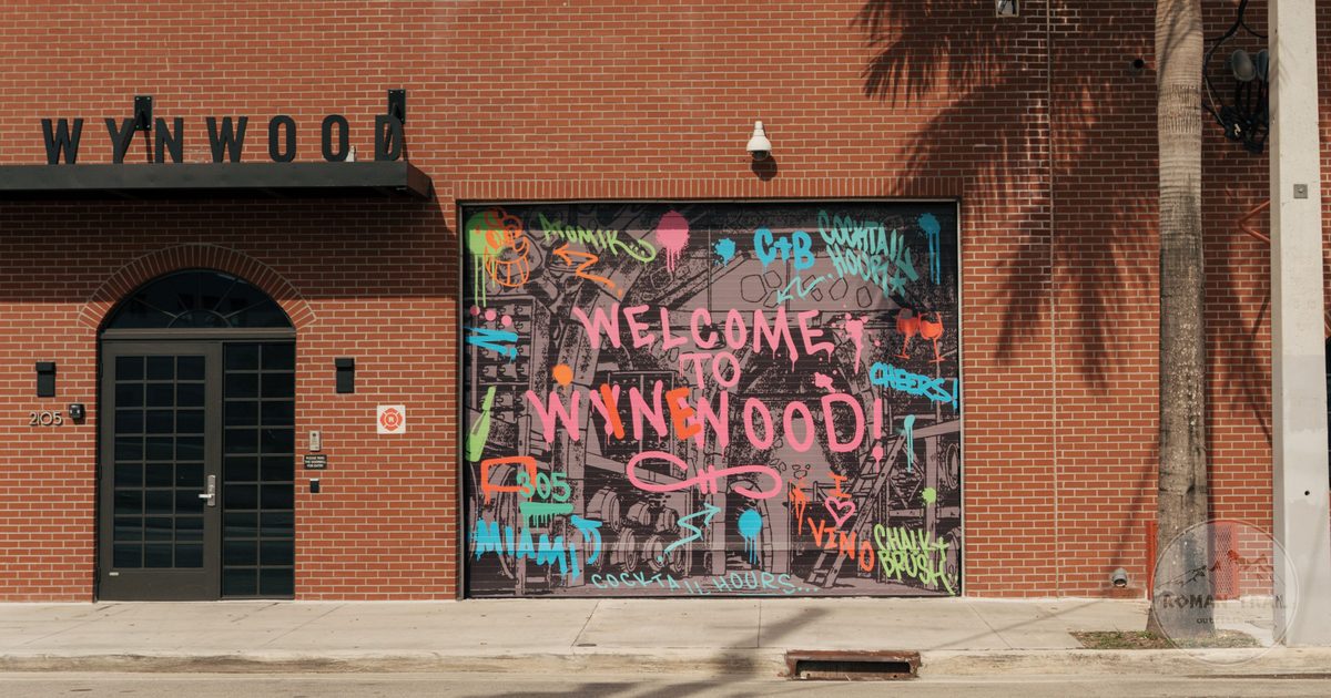 Welcome to Wynwood street art mural on a brick wall in the Wynwood arts district, Miami for women travelers