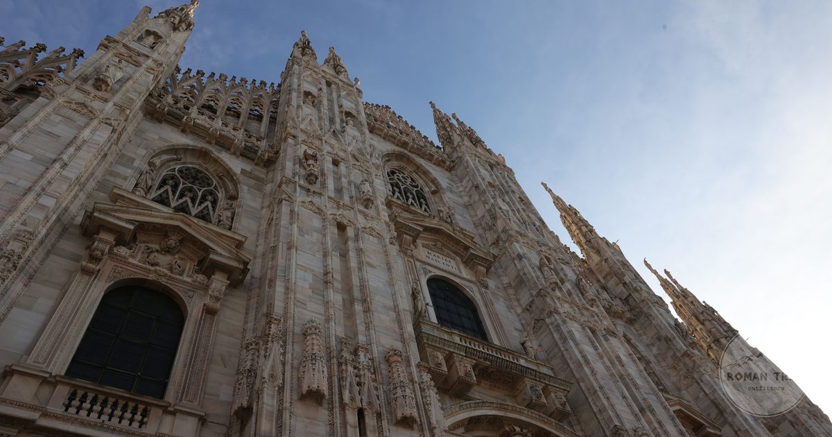 The spires of Milan Cathedral under a clear sky, Italy