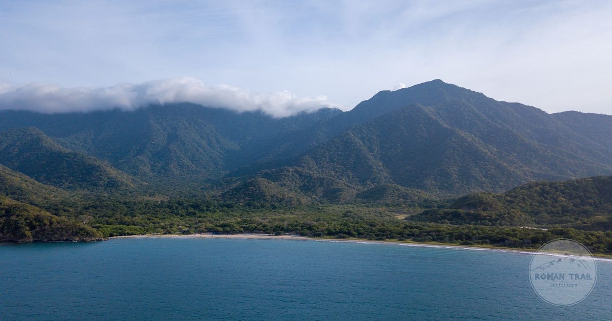 The Sierra Nevada mountains meeting the Caribbean Sea in Magdalena, Colombia