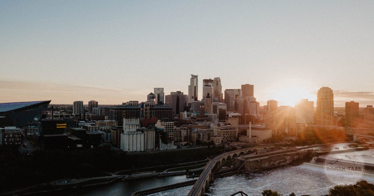 Minneapolis downtown above the Mississippi at sunset, Minneapolis travel guide for women by Roman Trail Outfitters