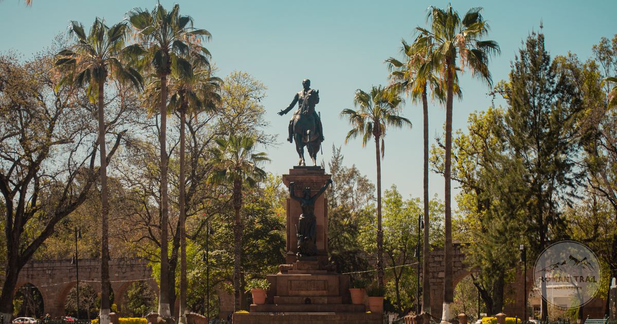 The Monument to Morelos among palms in a park in Morelia, Mexico