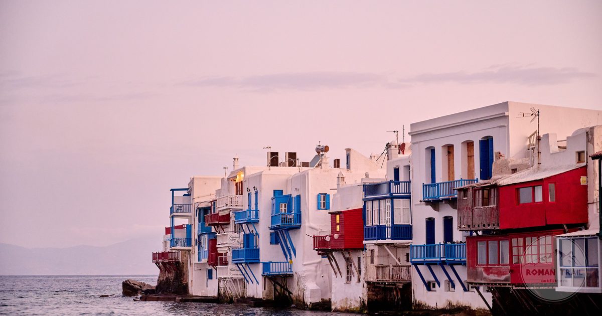 Colourful waterfront buildings at sunset in Mykonos, Greece