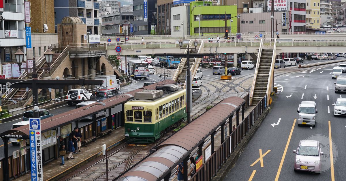 A tram on a busy street in Nagasaki City, Japan