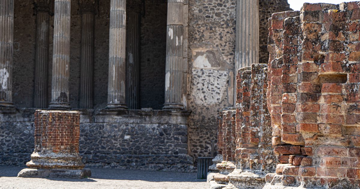 Sunlit ancient columns in the ruins of Pompeii, Italy