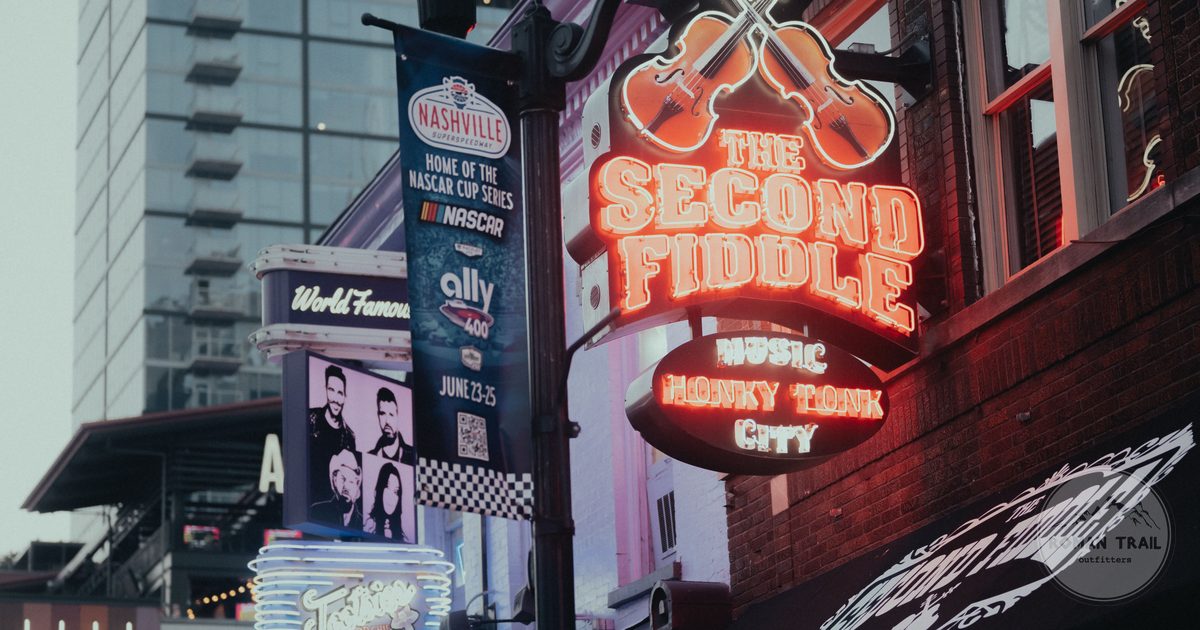 Neon honky tonk signs on Lower Broadway, Nashville for women travelers