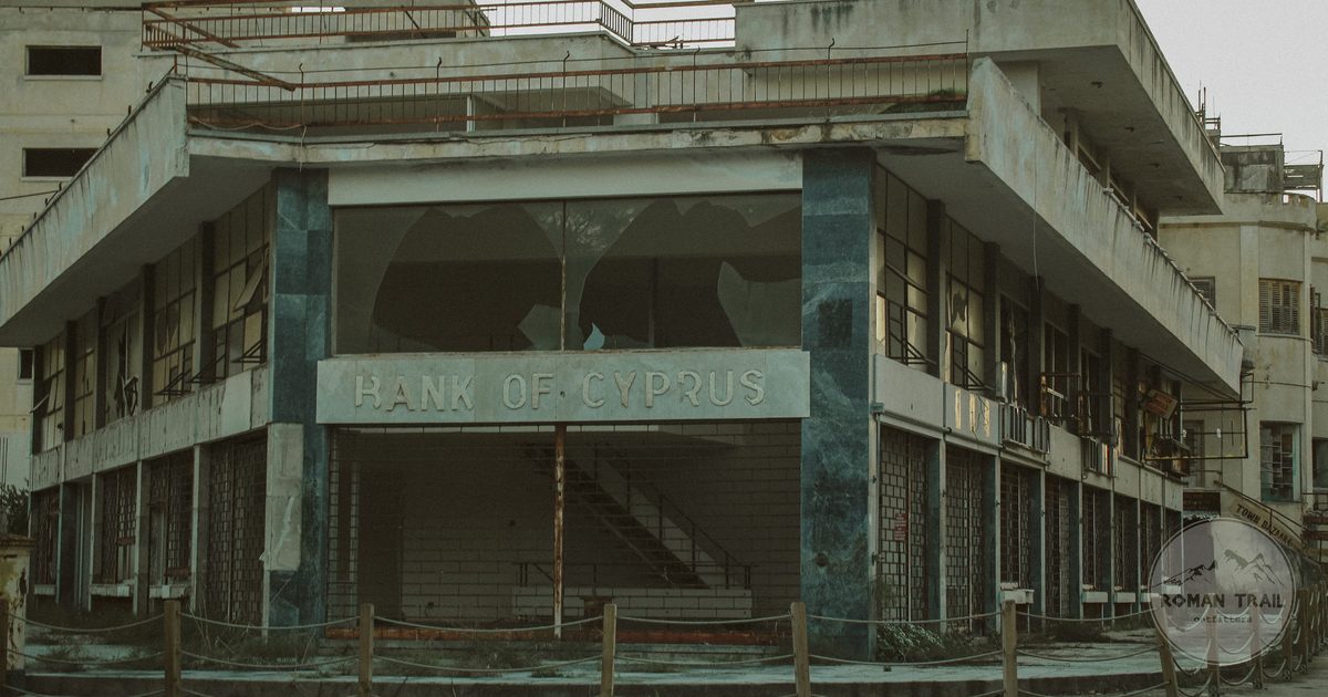 The worn facade of an abandoned bank building in Cyprus