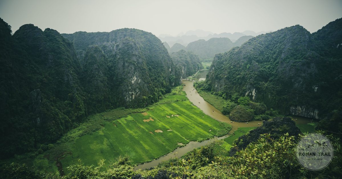 Aerial view of green fields and winding rivers at Tam Coc, Ninh Binh, Vietnam