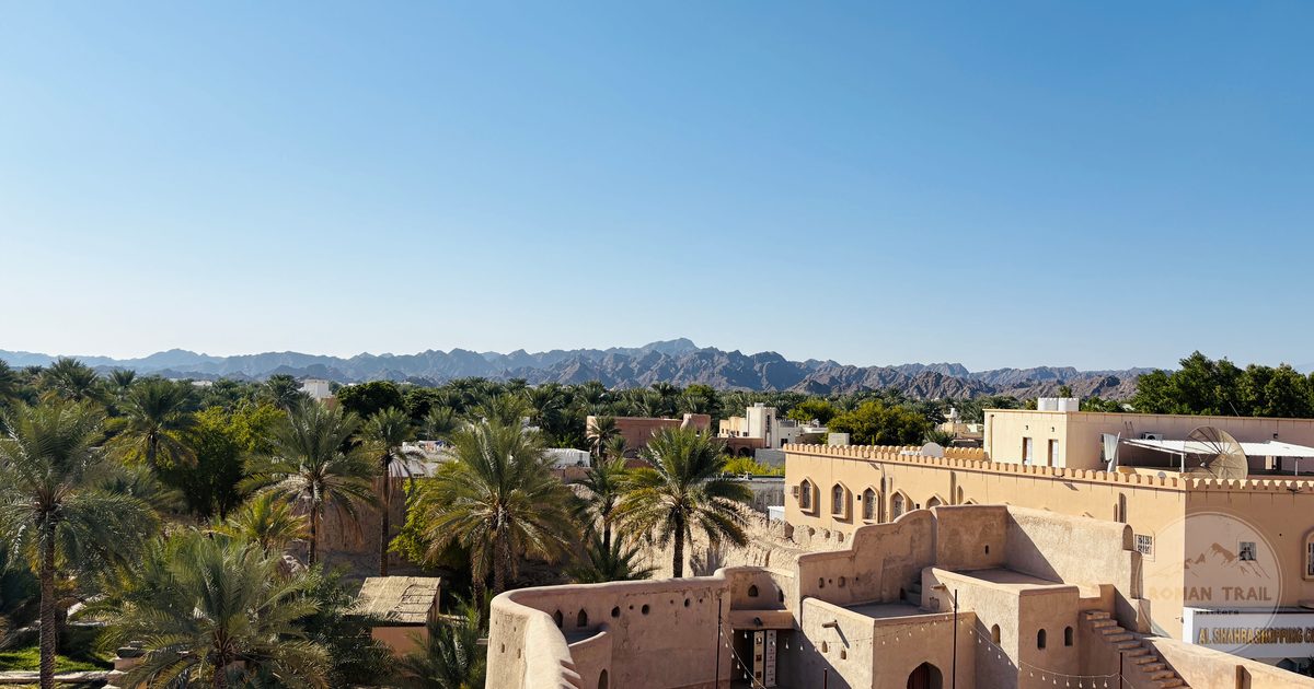 Nizwa Fort and the surrounding oasis below the Hajar Mountains, Oman