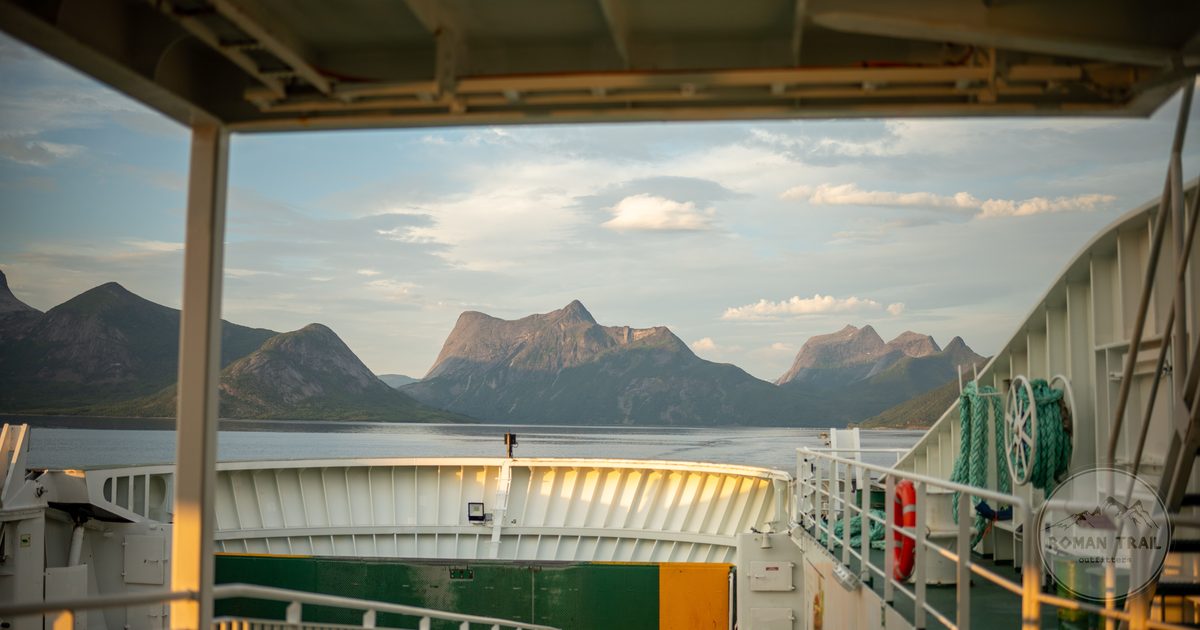 The view of a Norwegian fjord from the deck of a ferry on a clear day