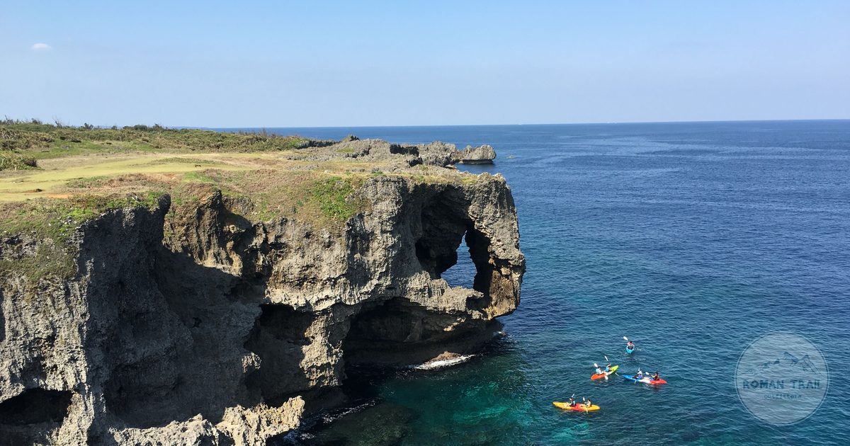 The Cape Manzamo cliffs above bright blue water in Okinawa, Okinawa packing list for women by Roman Trail Outfitters