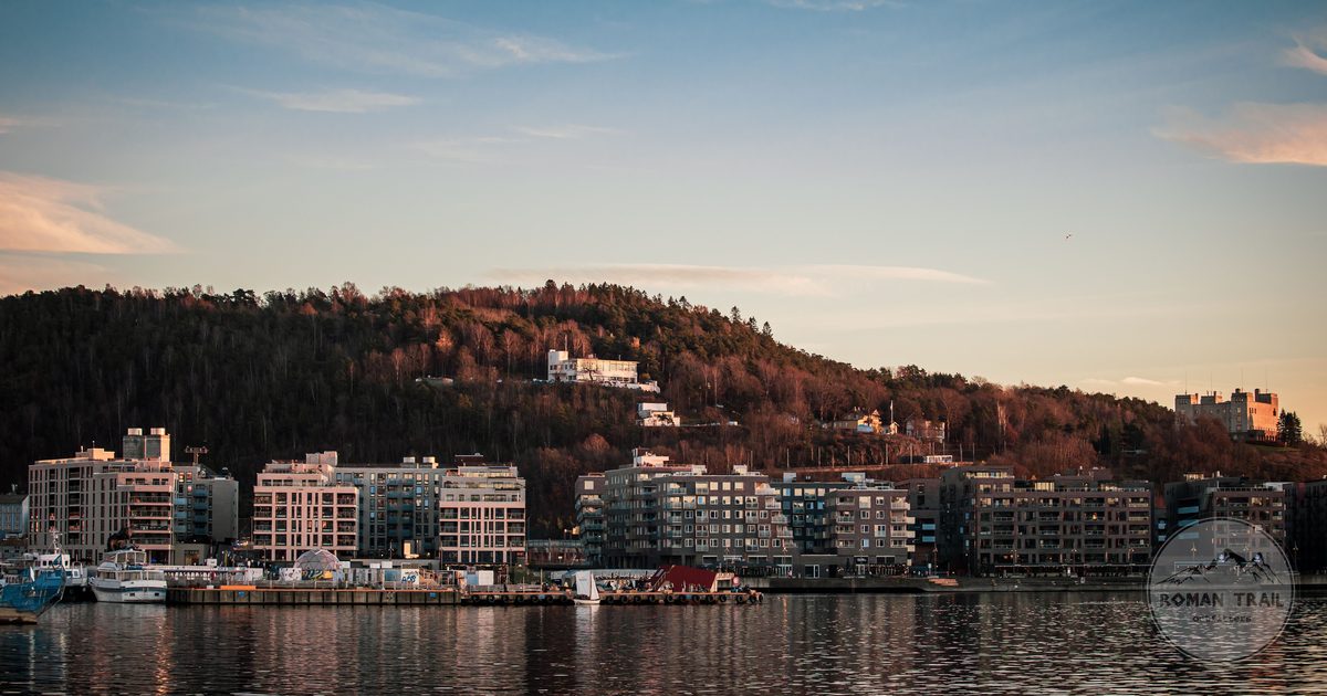 Oslo waterfront and skyline in evening light on the Oslofjord, Oslo travel guide for women by Roman Trail Outfitters