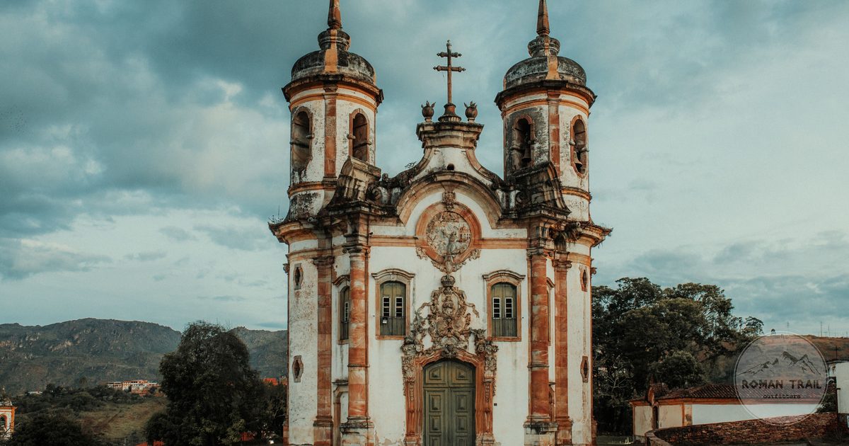 A baroque church under a dramatic sky in Ouro Preto, Minas Gerais, Brazil