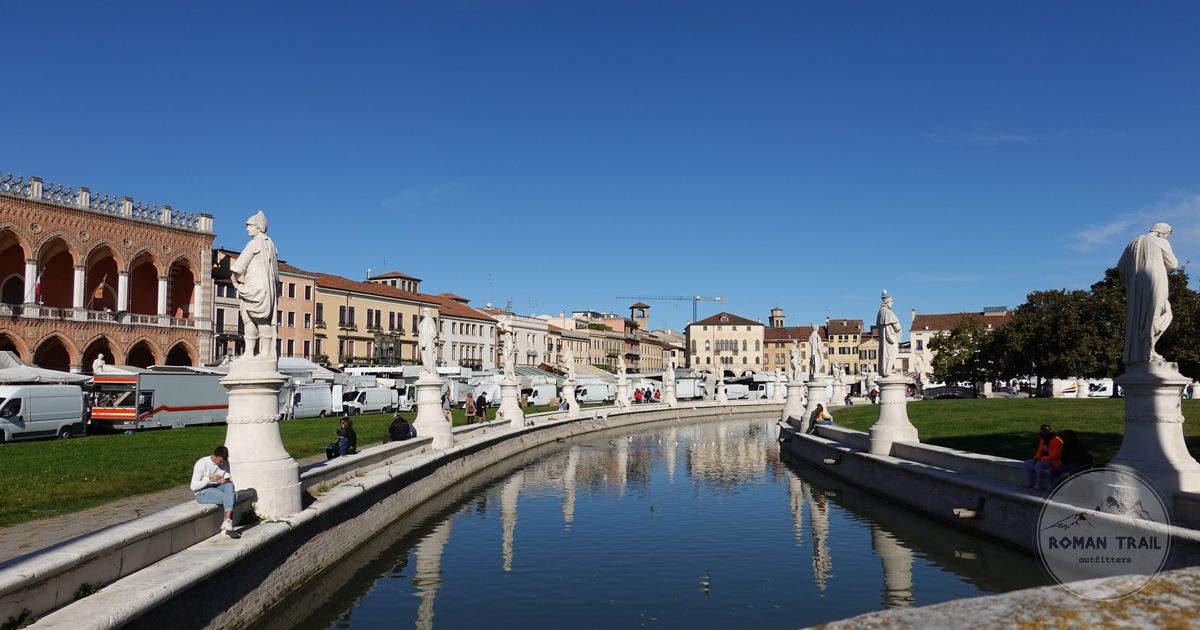 Statues and reflection in the water at the Prato della Valle, Padua, Italy