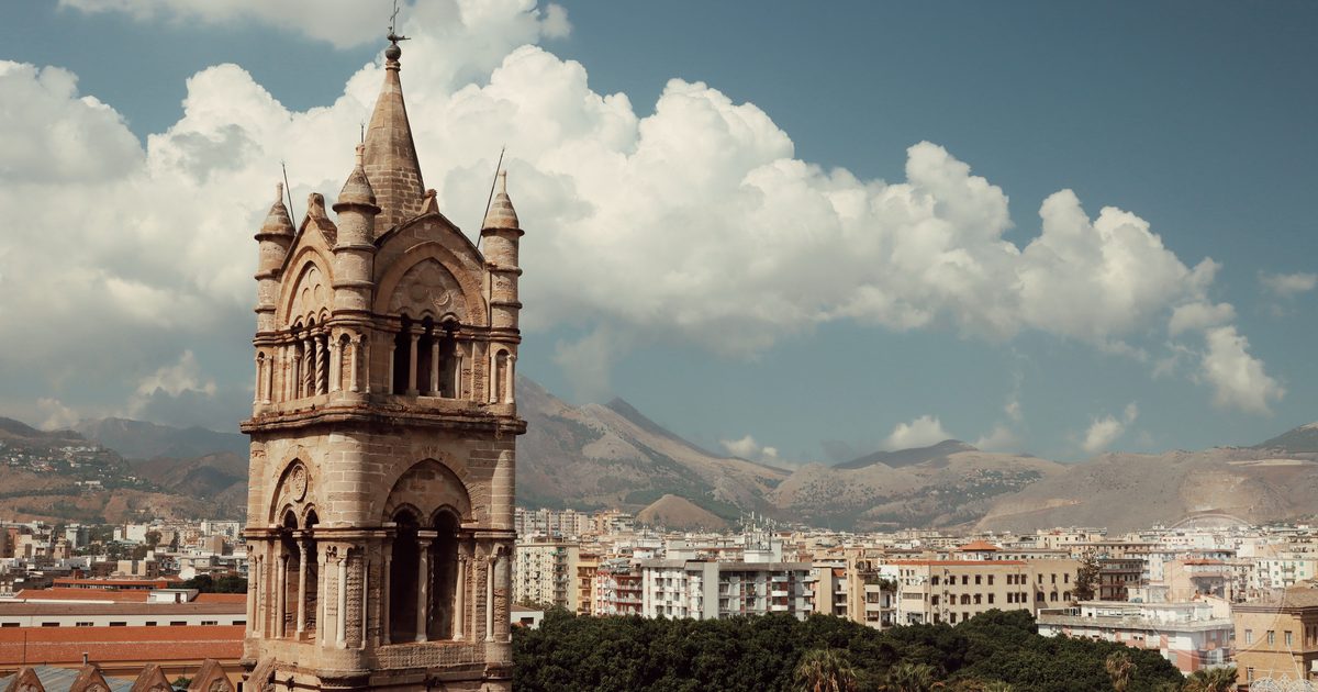 A medieval bell tower above the rooftops of Palermo, Sicily
