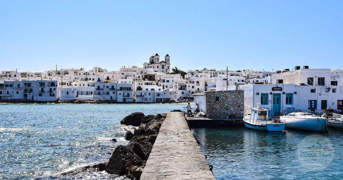 Boats and white buildings along the Paros waterfront, Greece