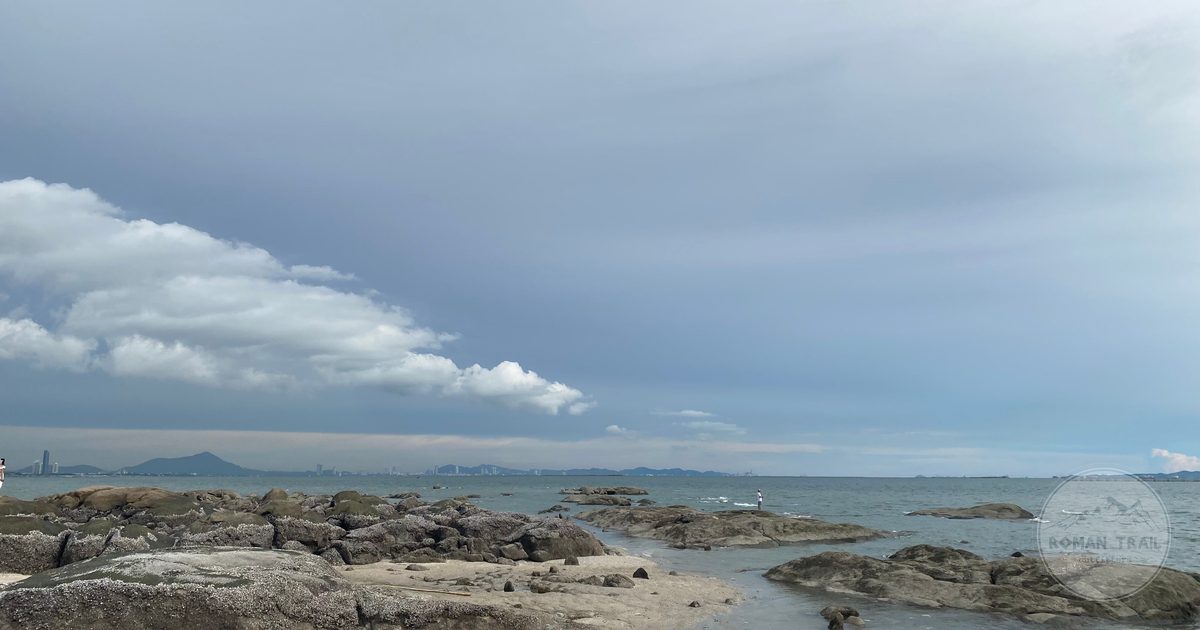A rocky stretch of coastline under cloud at Pattaya, Thailand