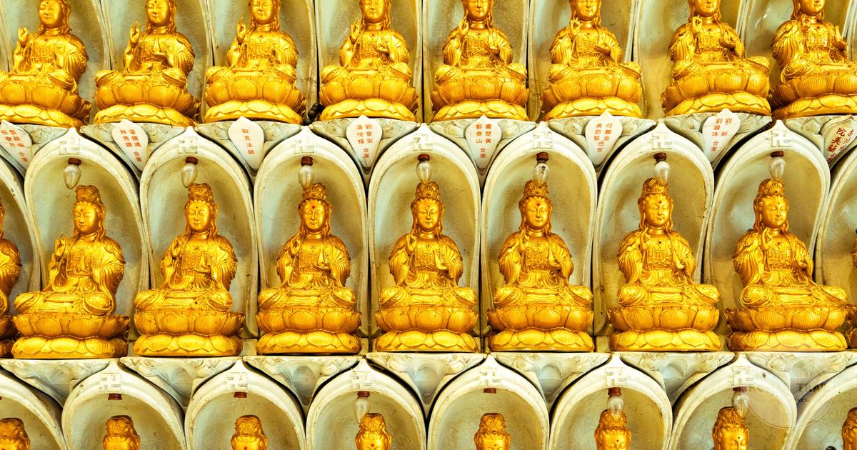 Rows of golden Buddha statues at Kek Lok Si temple in Penang, Malaysia