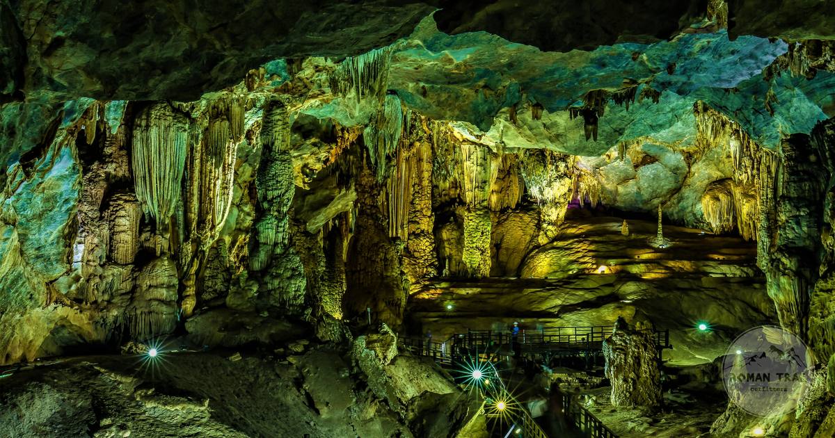Illuminated stalactites and stalagmites in a cave in Quang Binh, Vietnam