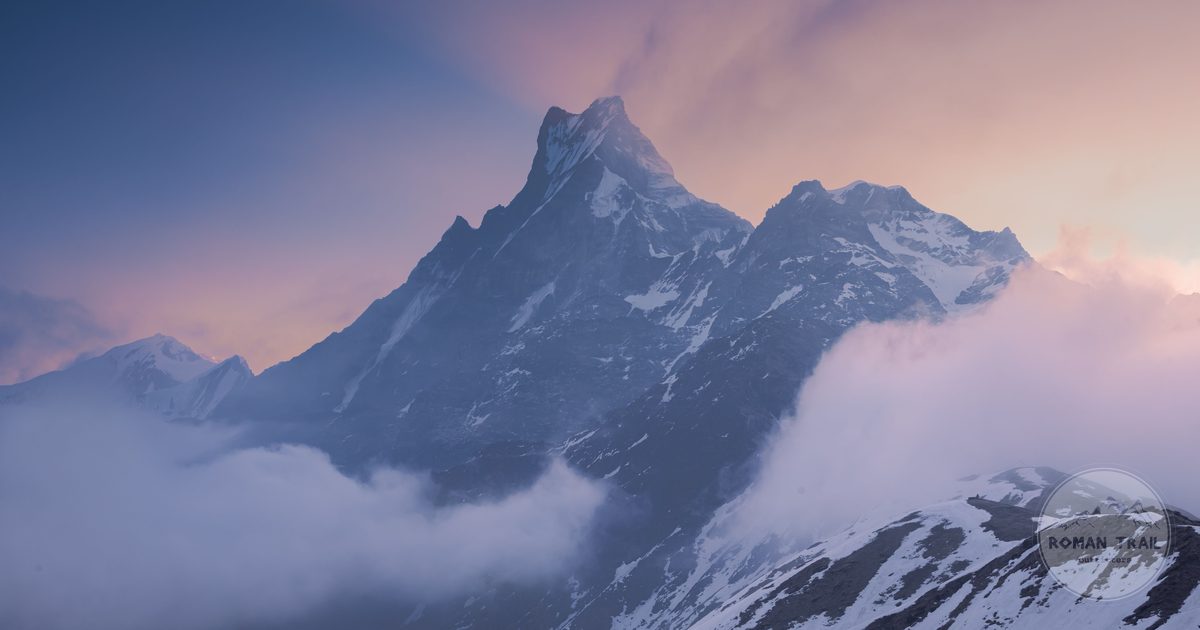 A snow-capped Himalayan peak above cloud at sunset, Nepal