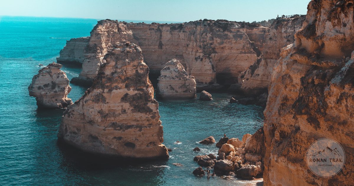 Rock formations and turquoise water at Praia da Marinha, Algarve Portugal