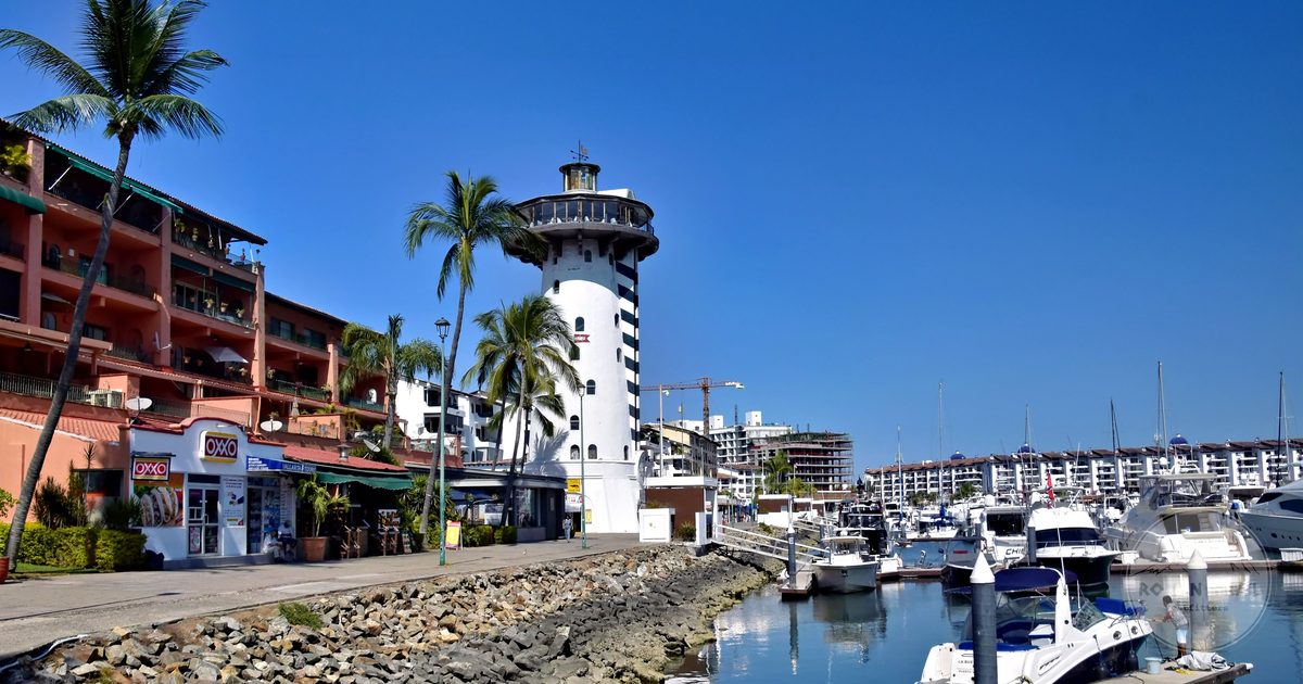 The Marina Vallarta lighthouse and moored boats, Mexico