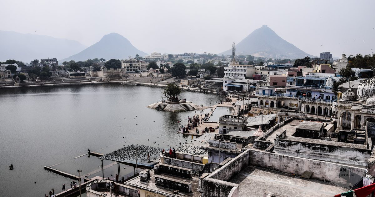 Aerial view of Pushkar Lake and the town below the hills, Rajasthan, India