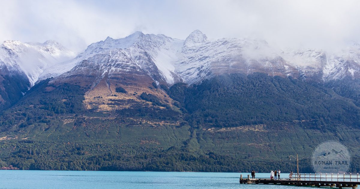 A dock on Lake Wakatipu with snow-capped mountains behind, Queenstown