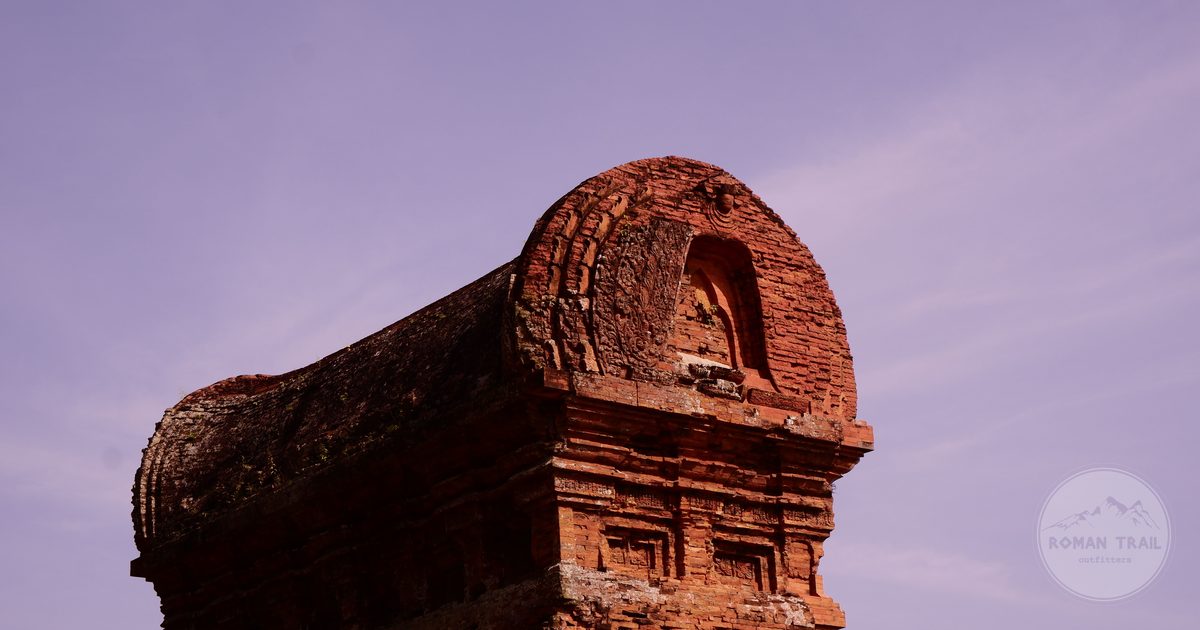 The Cham brick tower of Banh It against a purple sky, Vietnam