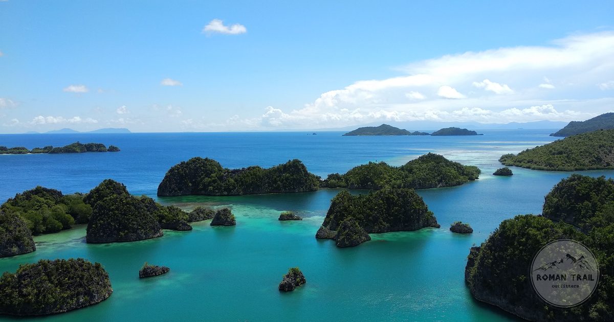 The Piaynemo viewpoint over scattered limestone islands in Raja Ampat, Raja Ampat packing list for women by Roman Trail Outfitters