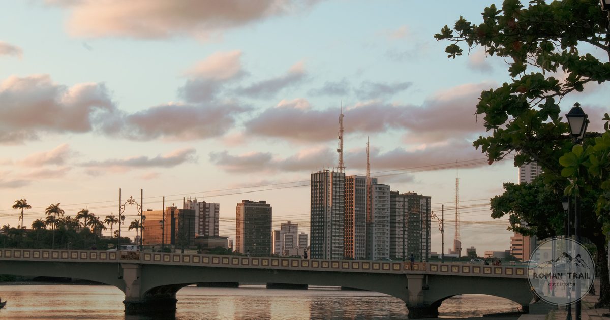 Sunset over a bridge and the city skyline at Recife, Brazil