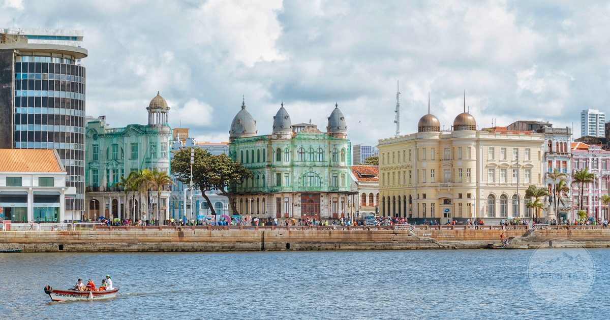 The historic waterfront buildings of Recife under a cloudy sky, Brazil