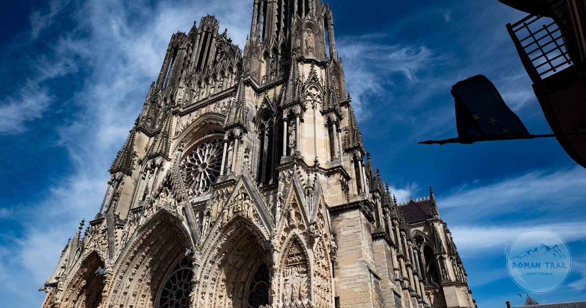 The Gothic west front of Reims Cathedral under a clear sky, France