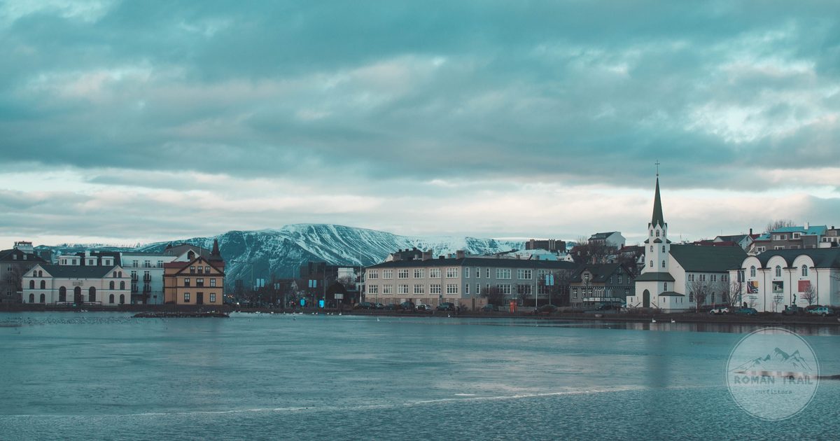Reykjavik's skyline and Tjornin lake under a winter sky, Iceland
