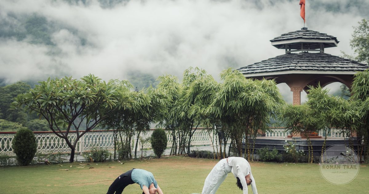 Outdoor yoga with the Himalayan foothills behind, Rishikesh, India