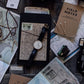 The Complete Women's Travel Packing System, travel journal and passport flat lay, Roman Trail Outfitters