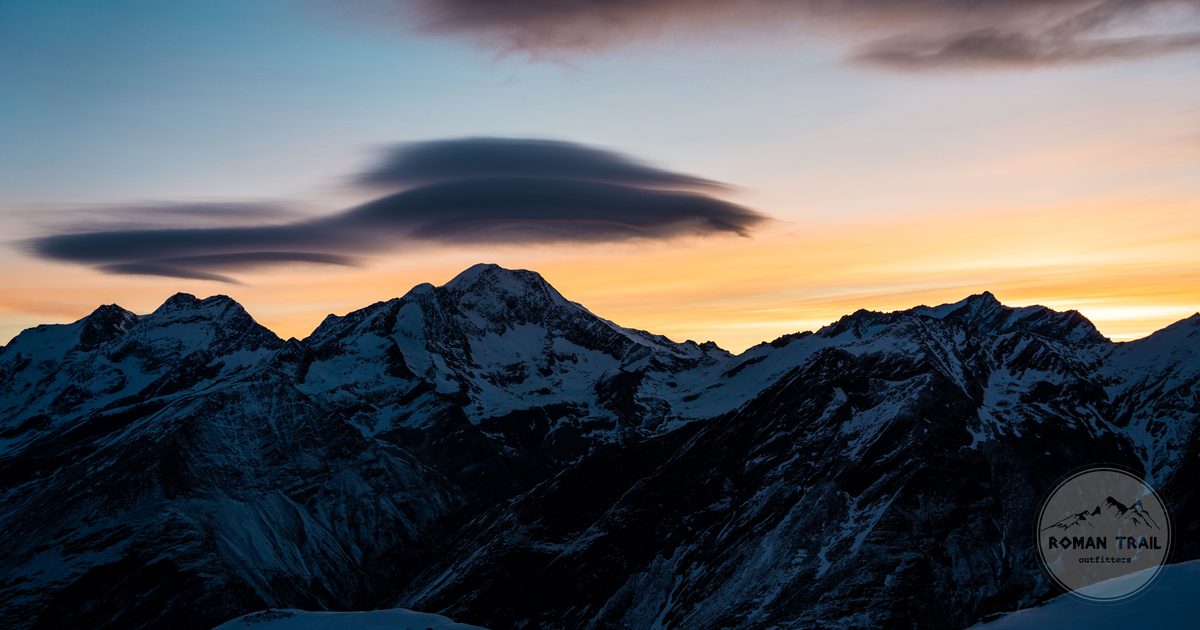 Winter sunset over the snow capped mountains at Saas Fee, Switzerland
