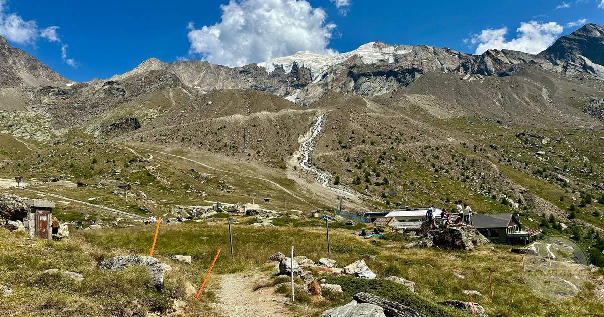 Hikers in the Swiss Alps at Saas-Fee in summer, Switzerland