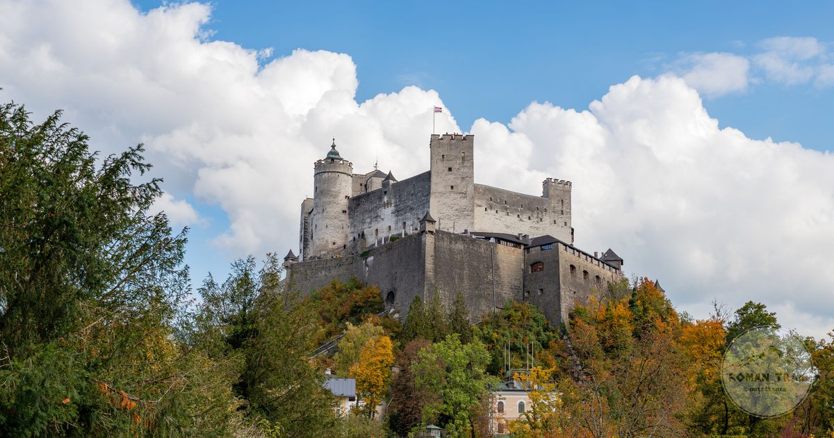Hohensalzburg Fortress among autumn foliage in Salzburg, Austria