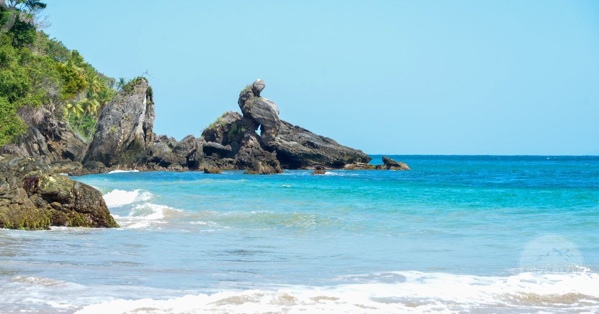 Beach and rocky cliffs along the coastline of Samaná, Dominican Republic