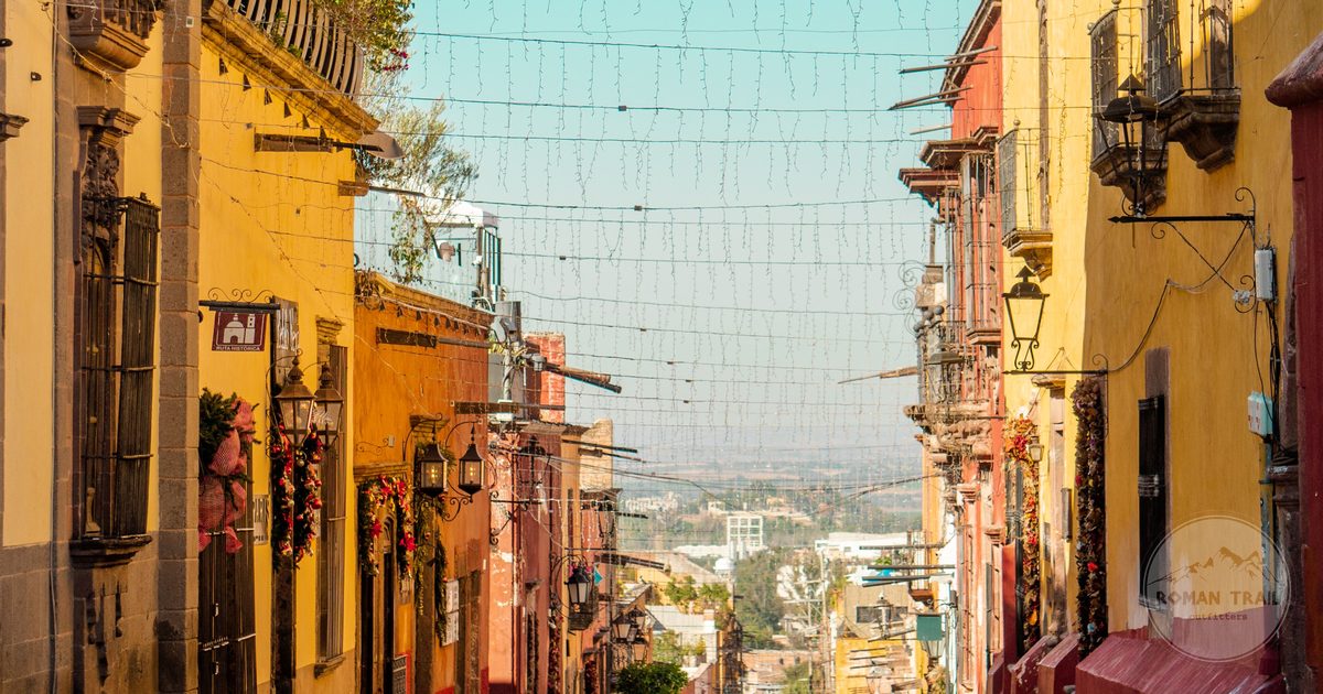 Colourful buildings lining a steep street in San Miguel de Allende, Mexico