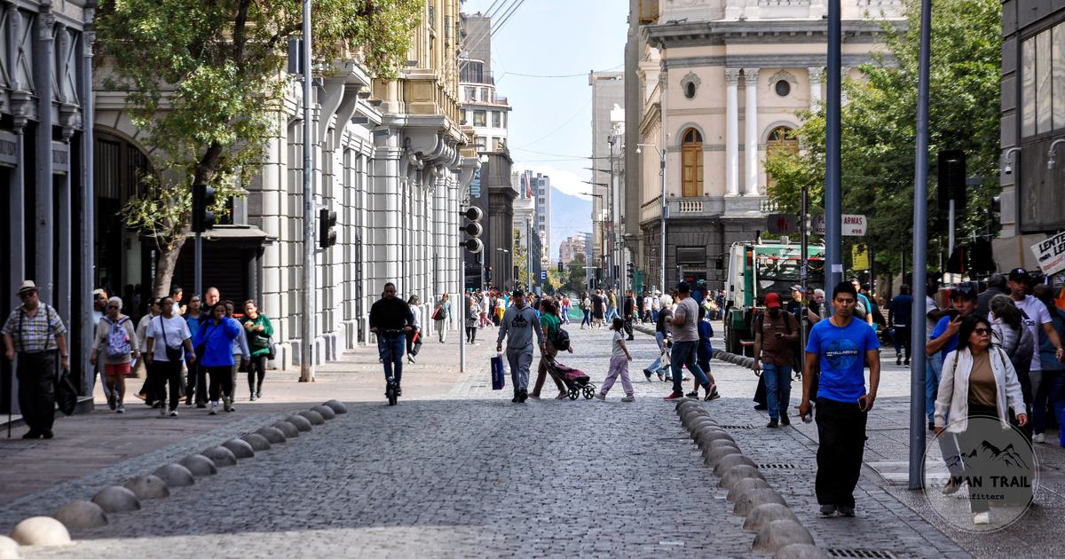 People walking a historic street in central Santiago, Chile