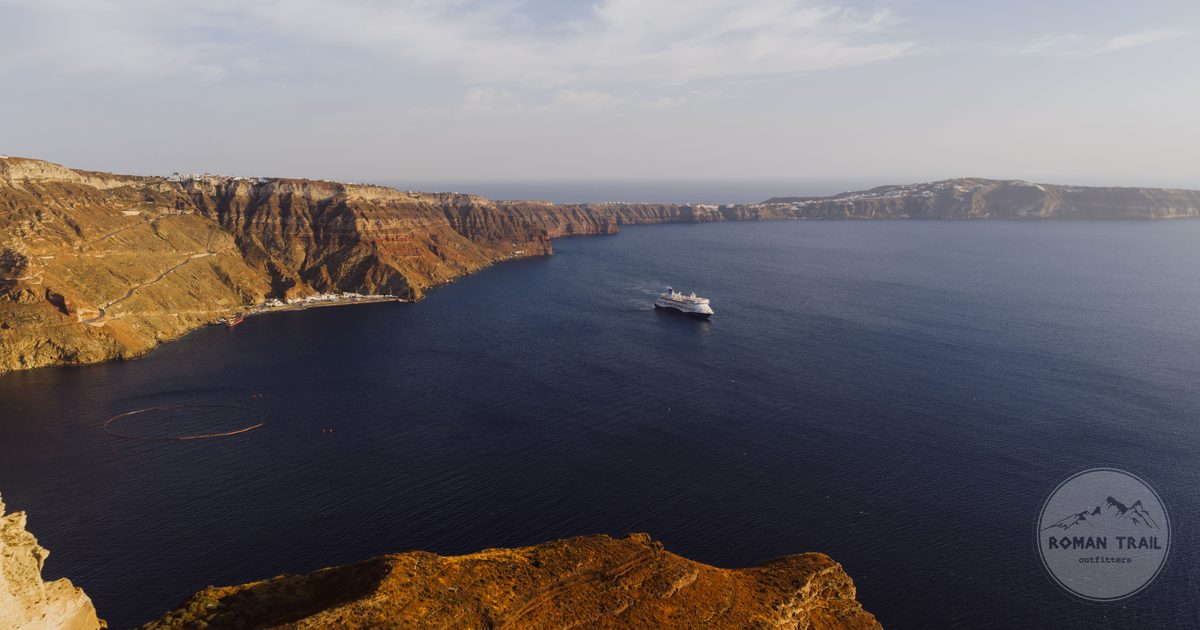 The caldera at Fira with a cruise ship below, Santorini, Greece