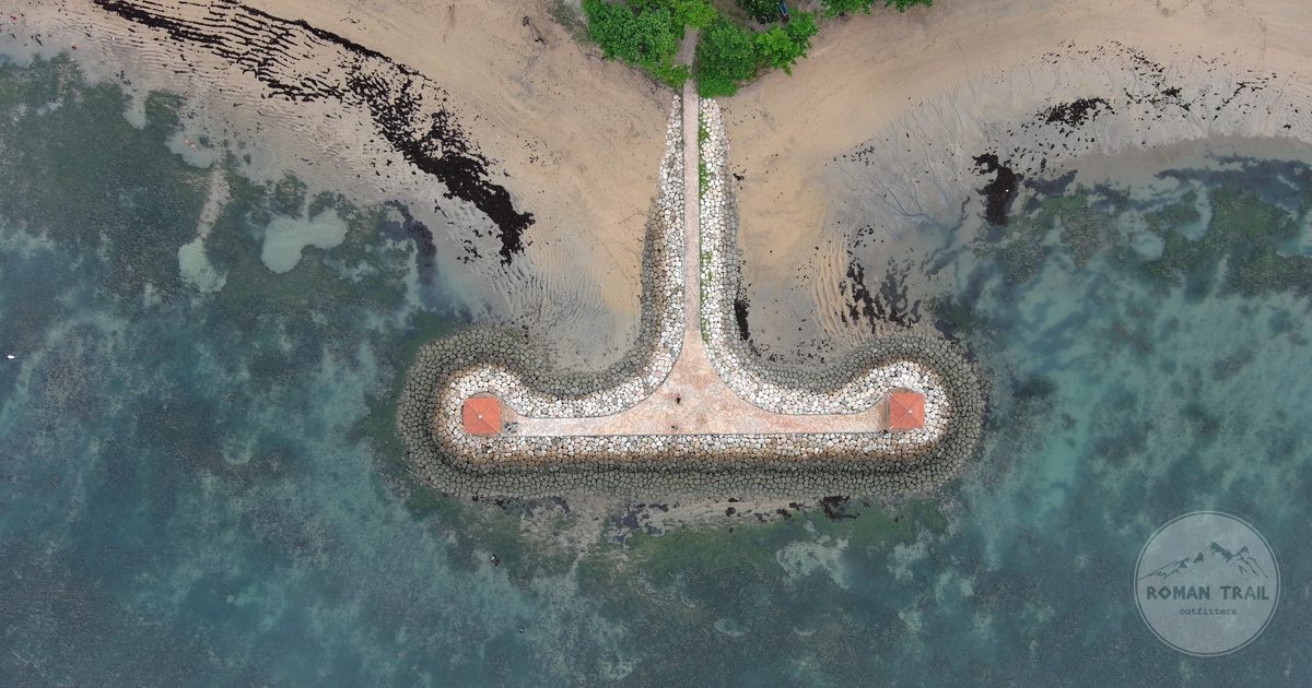 The stone pier and turquoise water at Sanur, Bali, Indonesia