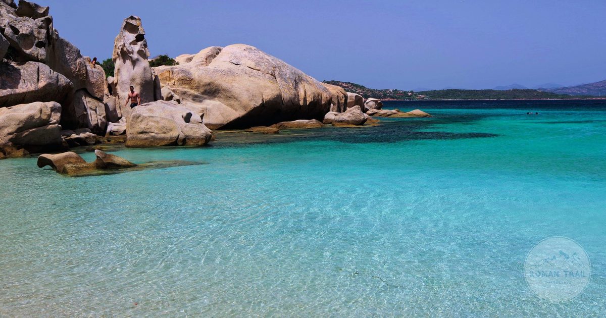 Clear turquoise water and rock formations on a Sardinian beach