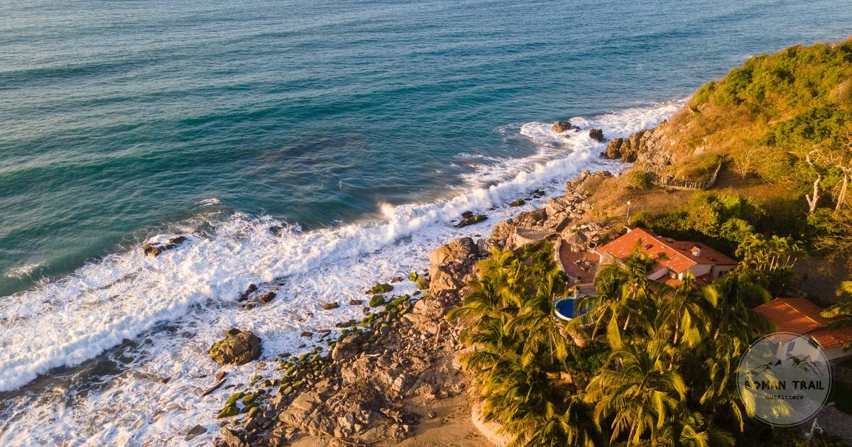 A beachfront house among palm trees at Sayulita, Mexico