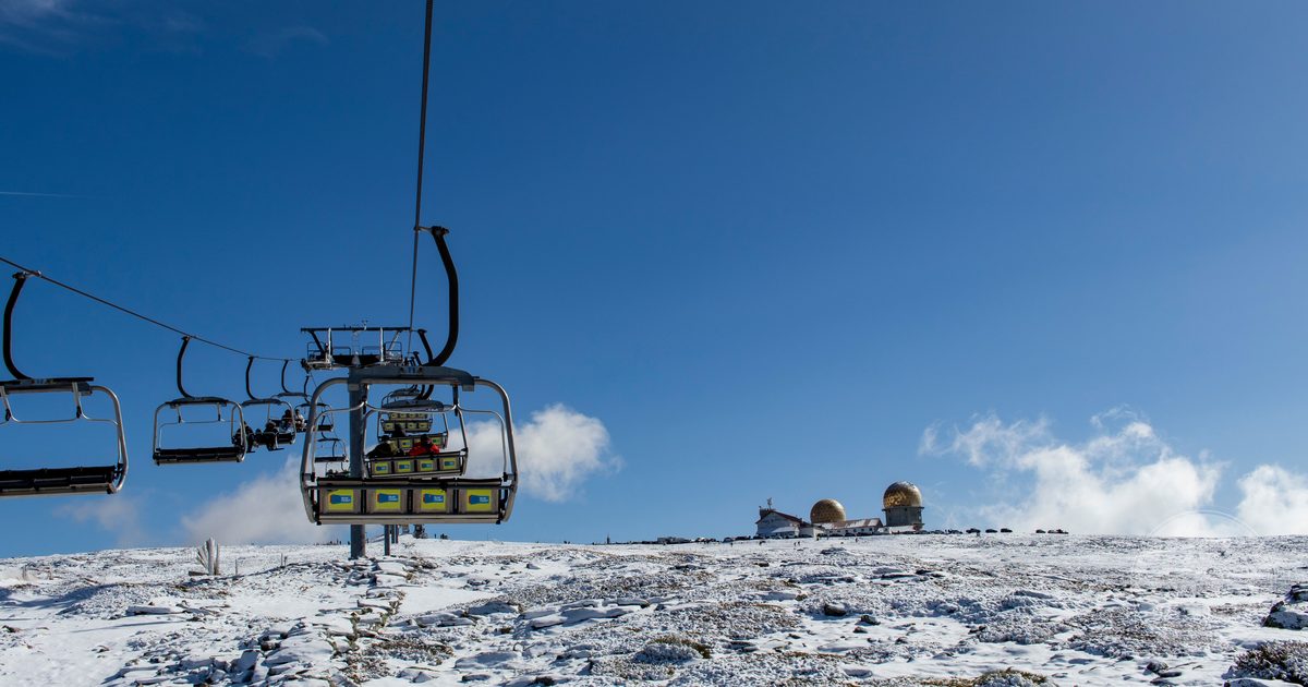 A ski lift and the observatory on the snow plateau at Serra da Estrela, Portugal